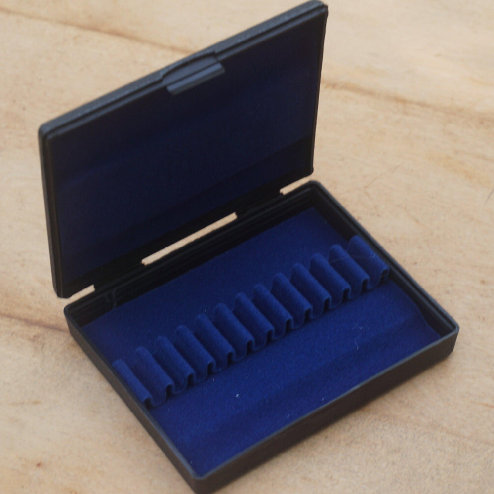 black plastic oboe reed case, with blue interior, holds your best 12 oboe reeds firmly in place 