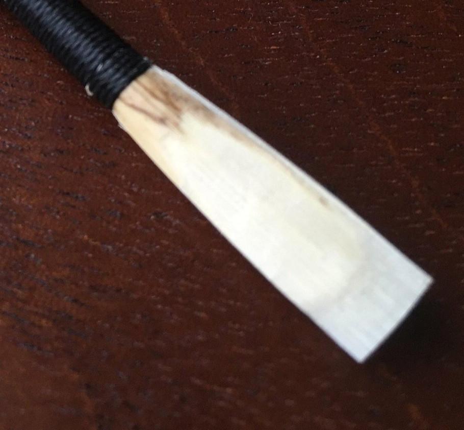 Student oboe reed made by Aaron Lakota to provide the best results, black thread with synthetic cork